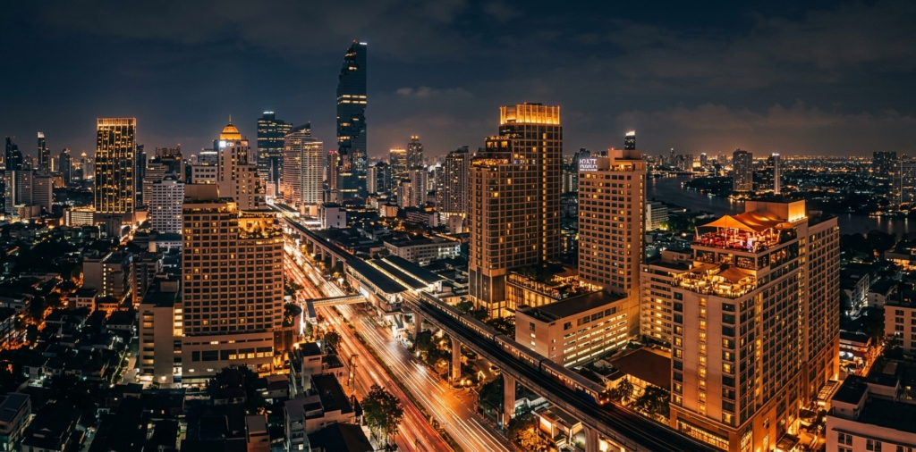 Bangkok skyline at night with luxury hotels near Sukhumvit nightlife district